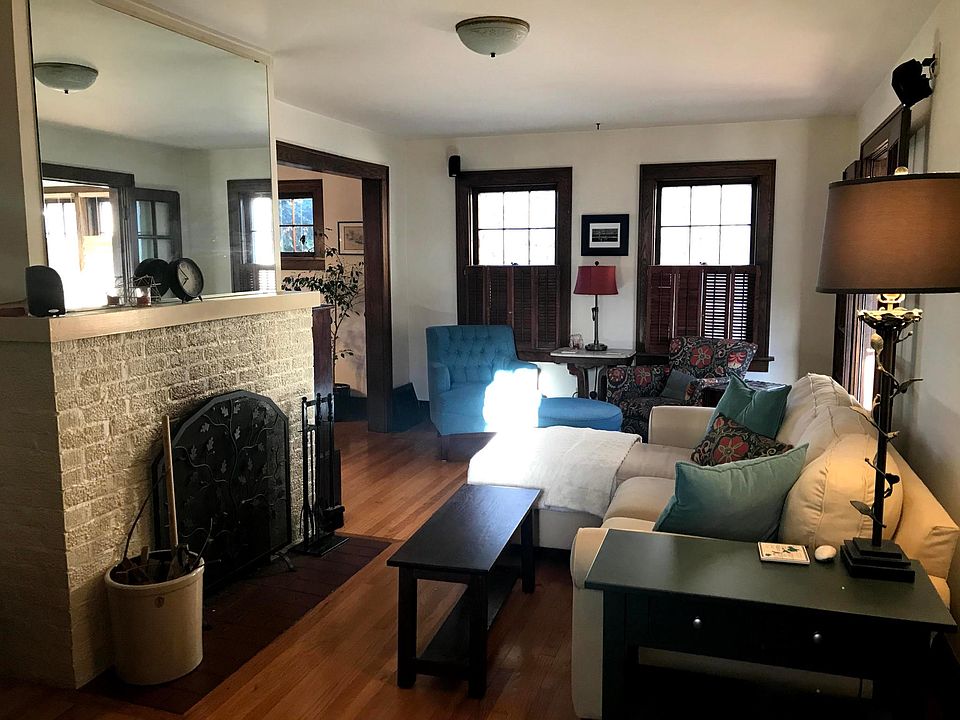 Living room, with fireplace and French doors.