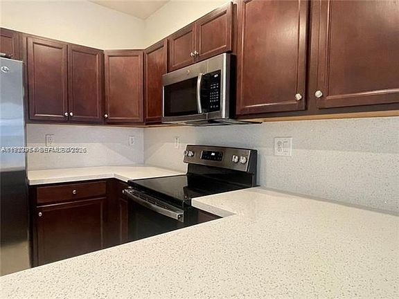 3rd image of 10491 W 34th Ct #Townhouse 10491