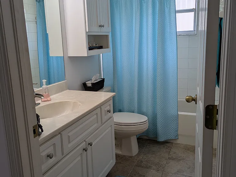 2nd bathroom right beside the 2nd bedroom with full tub + shower