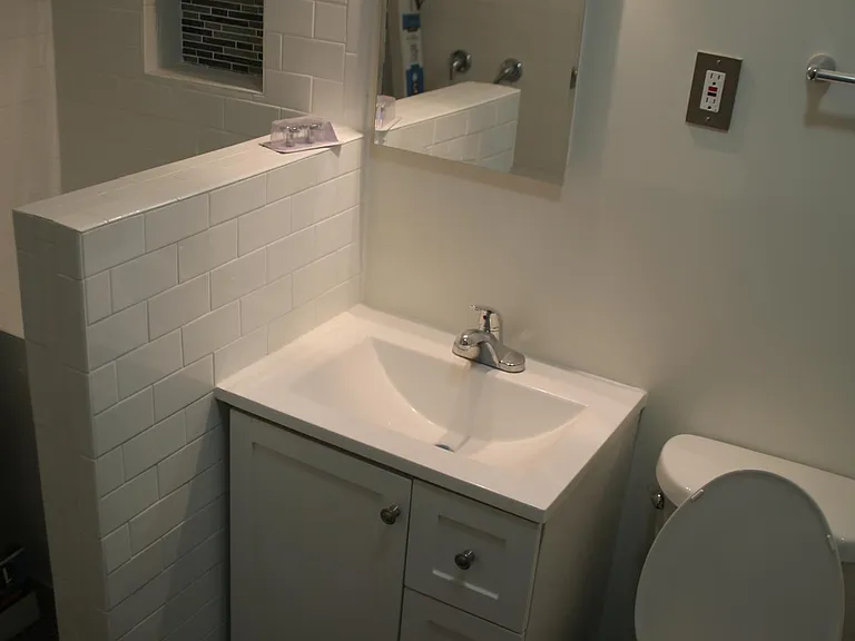 Large Bathroom #2 : Freshly and completely remodeled with modern look and a lot of light , with large shower open cabin...