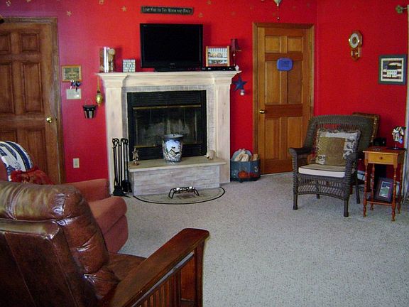Warm and cozy Family Room
						:
						Family room off kitchen with wood burning fireplace.
