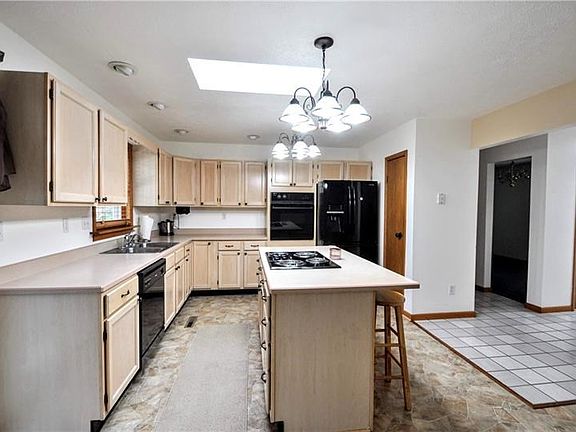 Can we talk about this kitchen?? OKAY! First of all: Tons of counter/cabinet space. PLUS, large central island for grabbing quic