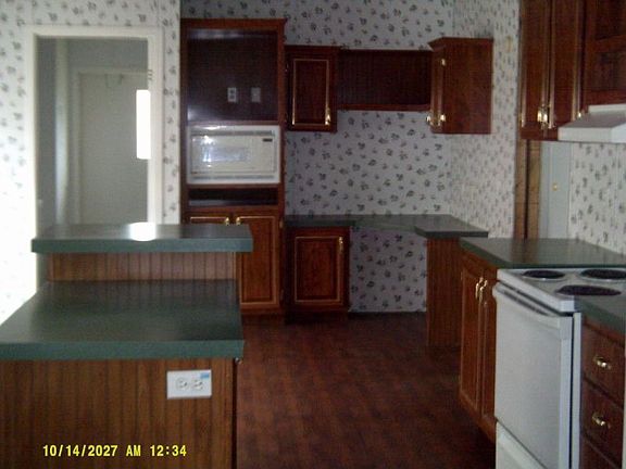 Kitchen has desk/work area