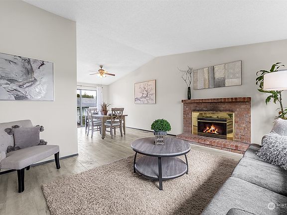 The entry hall opens into the airy light-filled living room. >
