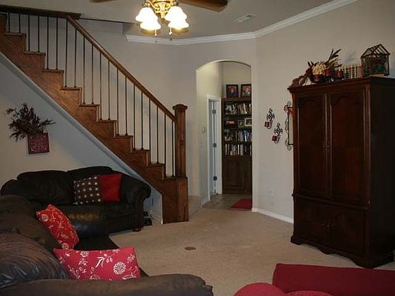 living room view from kitchen with built-in shelves