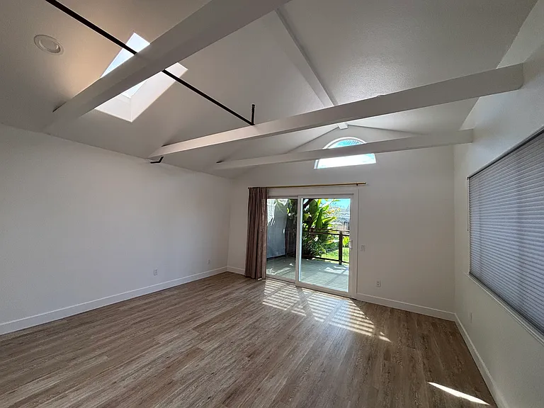 living room, vaulted ceilings, slider to private patio