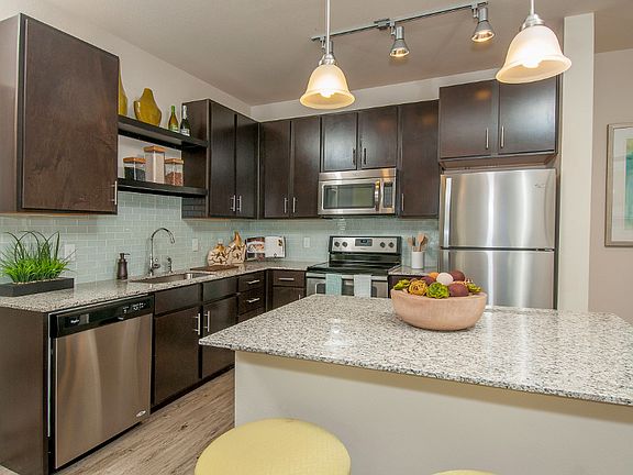 Kitchen with island and stainless steel appliances