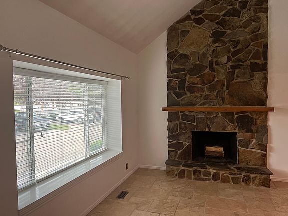Living room bay window and fireplace