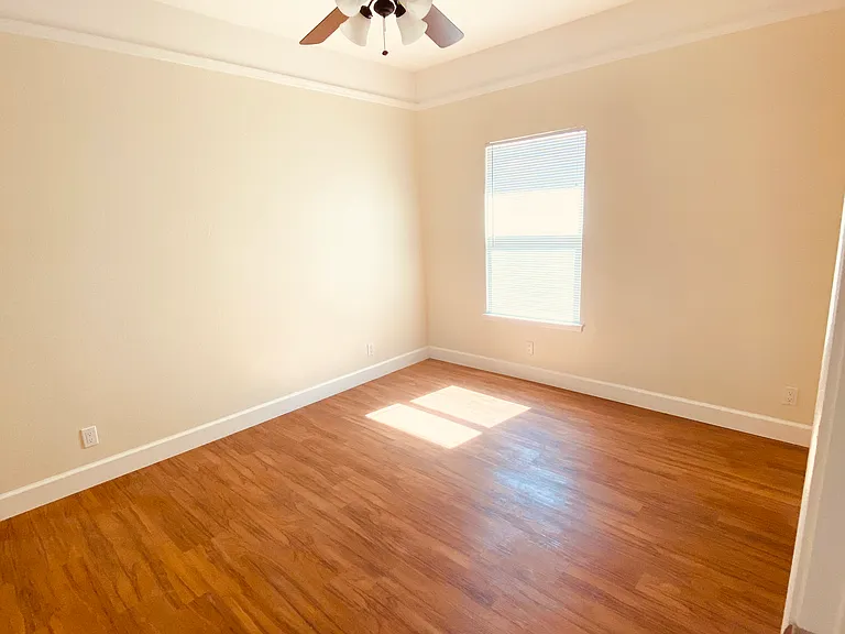 Spacious room with a west facing window.
