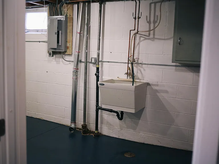 Large utility room with new furnace/AC installed in 2019. Onsite laundry in included in this ample space (not pictured). Great for storage or a hobby!