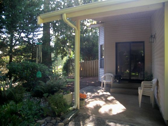Covered porch located at the rear of the property off the Great Room eating area.
