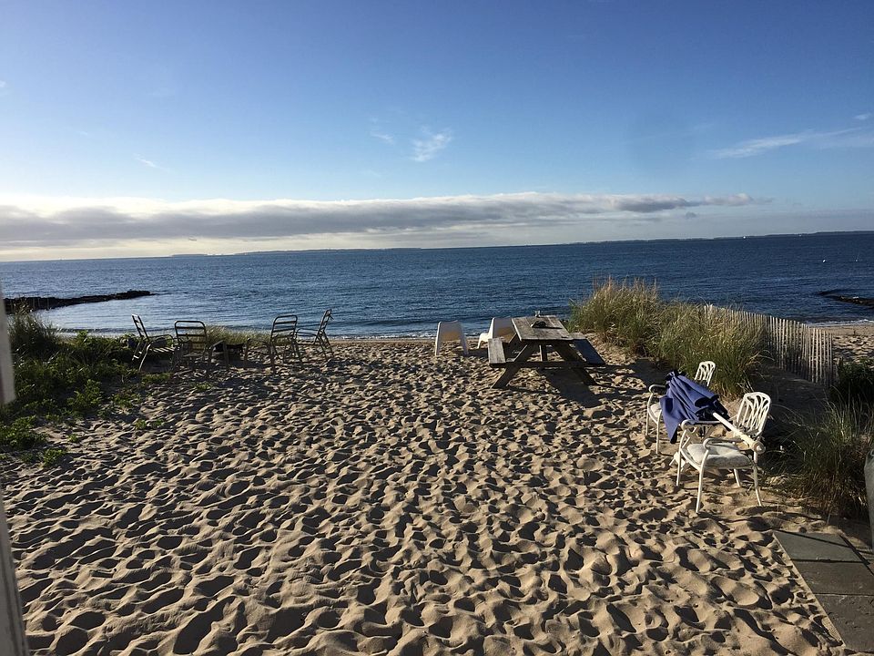 Soft sandy beach with beach chairs, fire pit, gas grill and picnic table.