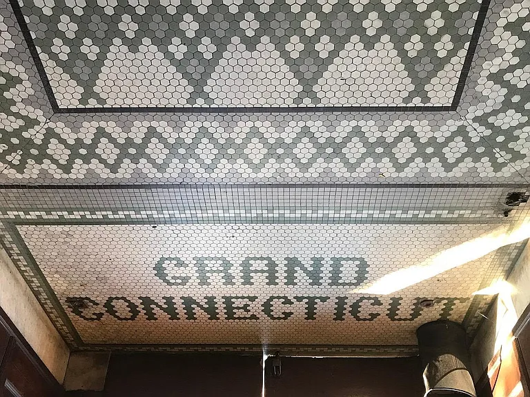 Original tile work at each entrance.