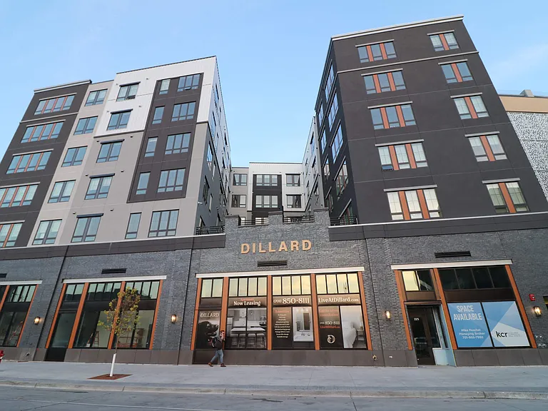 Five Stories of Apartments with Local Businesses on 1st Floor