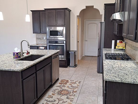 Gas Cooktop, microwave, oven, refrigerator all included during rental.