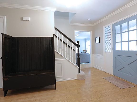 Step into the foyer, and turn left for the formal living space, or right, to the main family room.