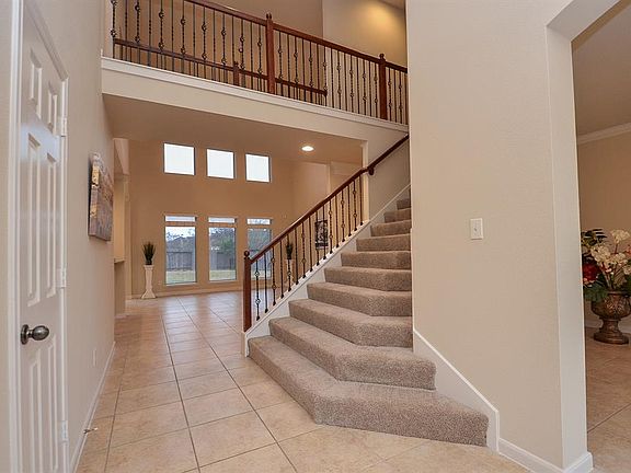 The layout of this home was carefully designed with convenience in mind. A stunning stairway leads out of the bright ground-floor entryway.