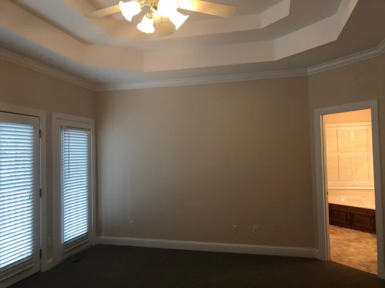 Master bedroom with view into master bath