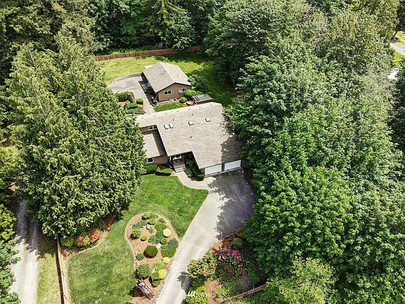 Behind the house is a charming DADU, detached additional dwelling unit.  Perfect for short term rental, guests, shop space or Game-Day celebrations!