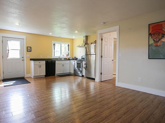The kitchen has been repainted to a lighter color, see other kitchen images for reference. I included this image for size context.
