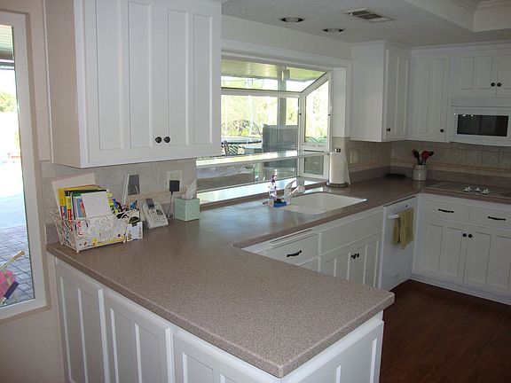 Corian counter tops and vinyl garden windows
