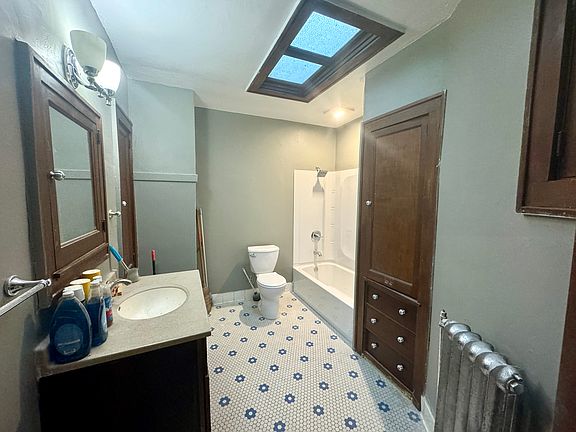 UPDATED Bathroom (huge!) w/ built in cabinets and storage.