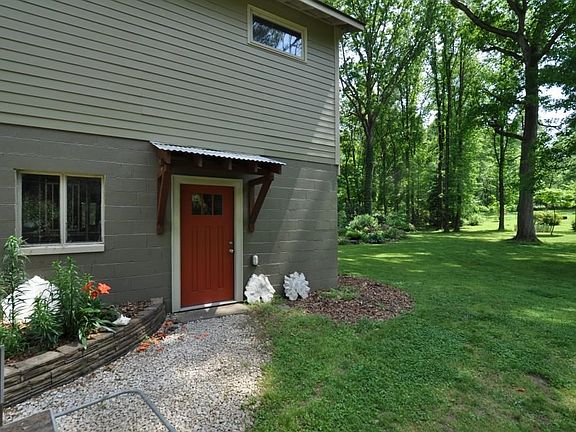 Side entrance to garage and upstairs studio