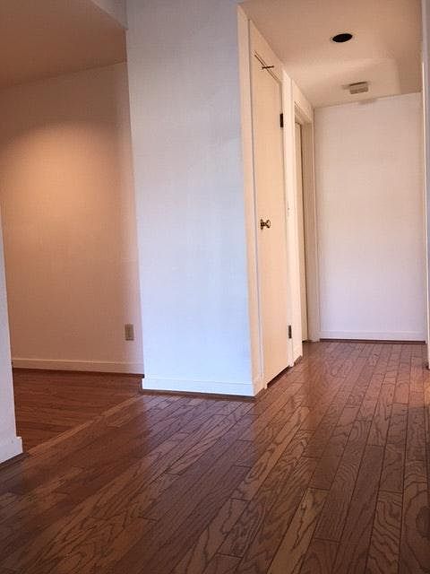 spacious entry with hardwood flooring