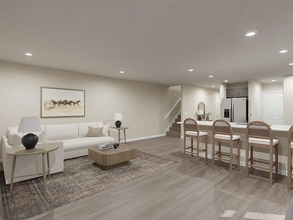 Enjoy a bright and open living area - Daisy townhome by Highland Homes Artist s rendering
