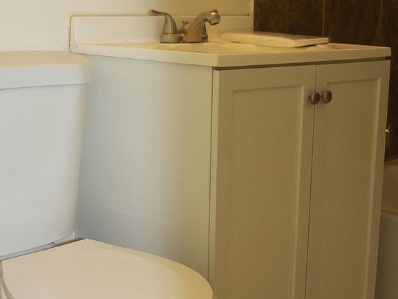 Bathroom vanity and toilet