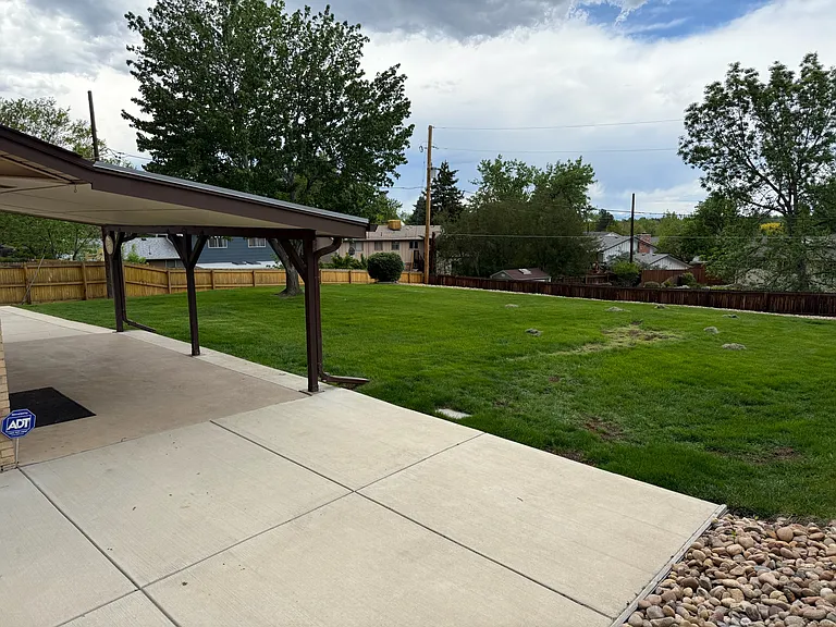 covered back patio, large fully fenced backyard (lawncare included in rent)