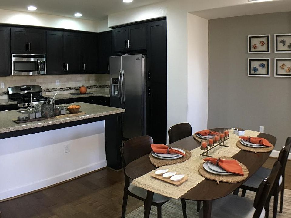 Kitchen. Lots of cabinets and stainless steel appliances. Lots of storage.