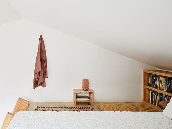 Lofted bedroom space with sturdy, movable ladder