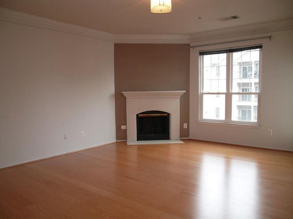 Spacious and bright living room with hardwood floors.