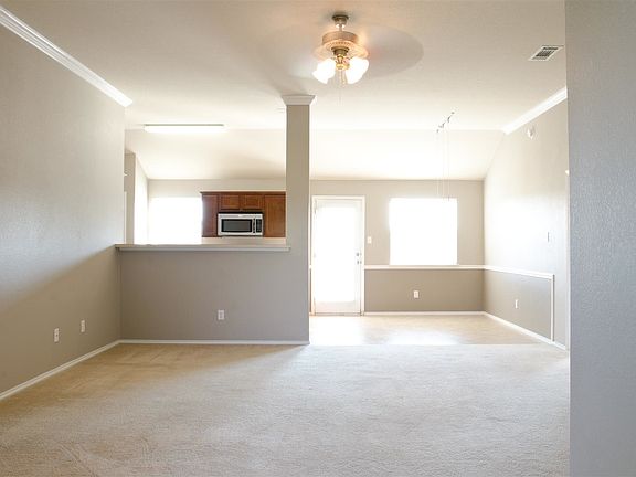 Main living area with 10' ceilings and crown moulding