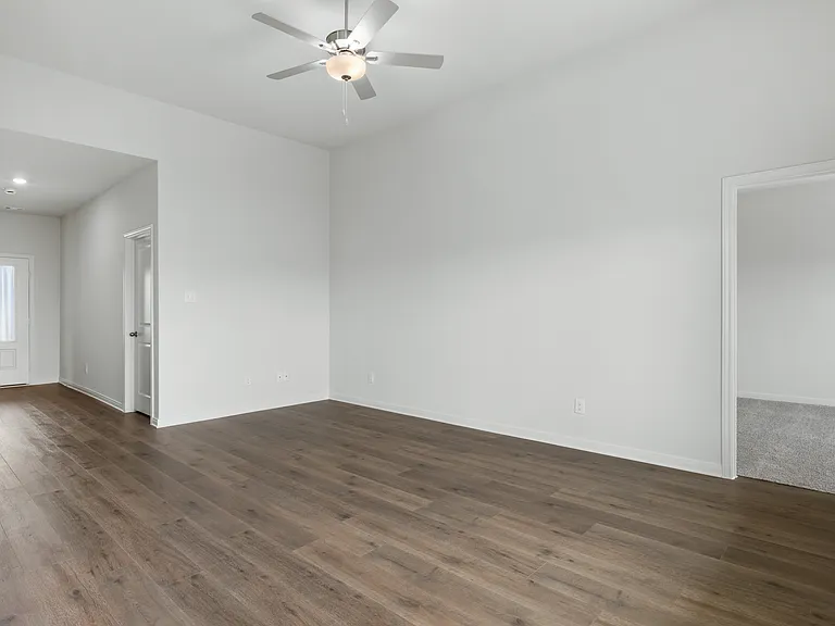The open living spaces have luxury vinyl plank flooring.