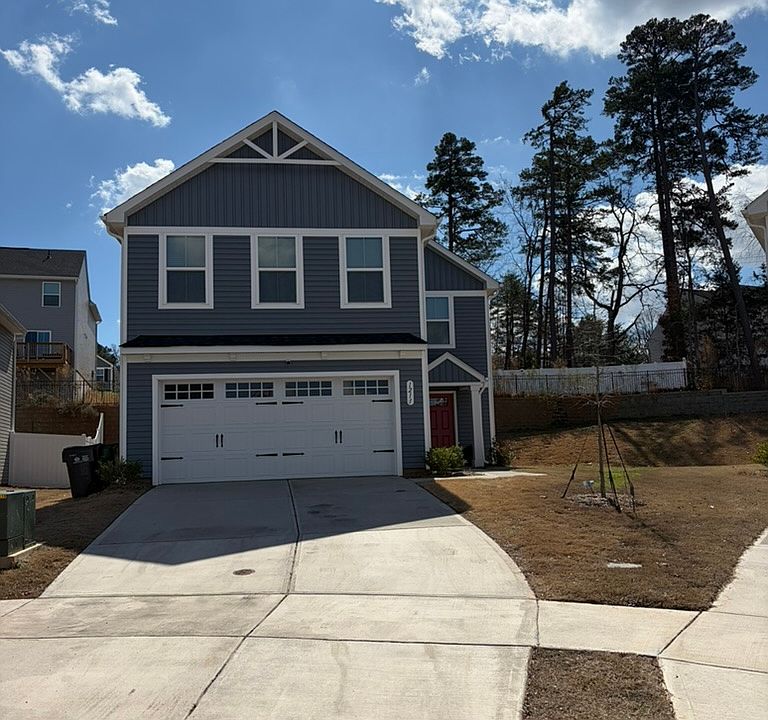 Front view; with 2 car garage and 4 car driveway