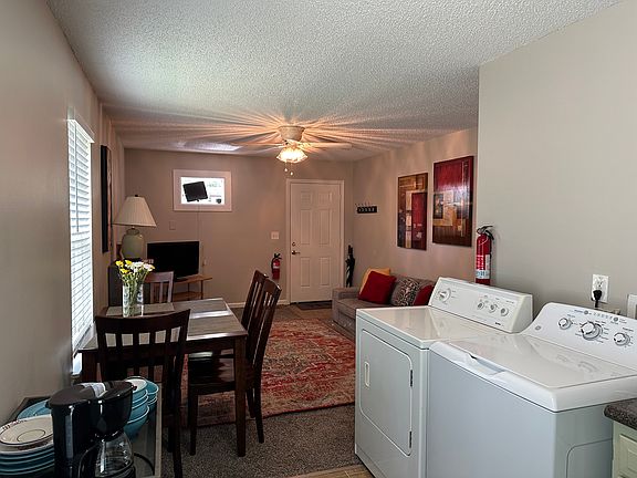 looking from kitchen to kitchen table and living room