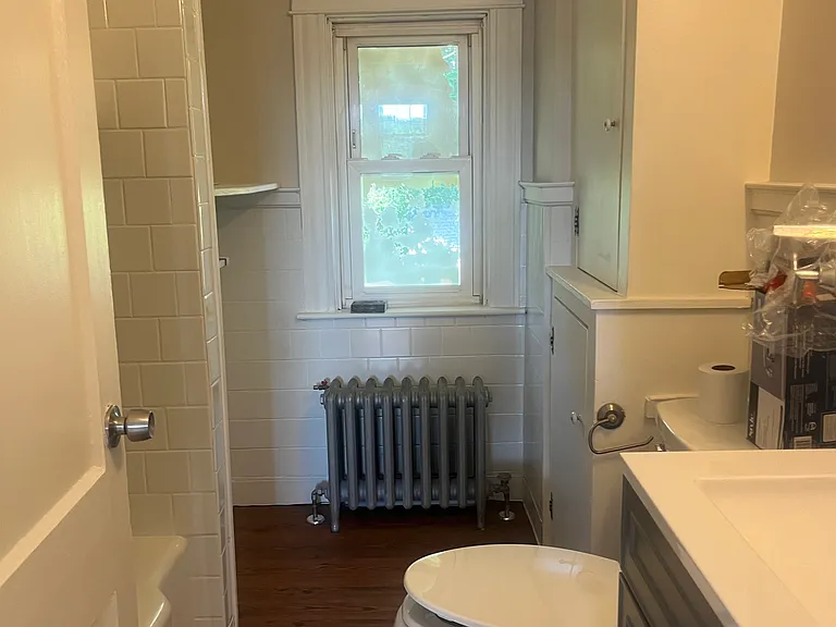 Full bathroom, new vanity, toilet, and light , freshly painted