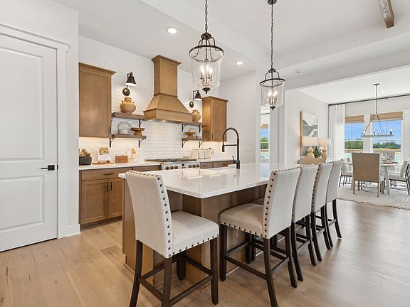 Kitchen with pendant lights over island