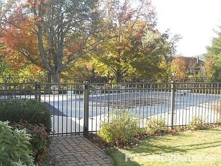 Pool
						:
						16 x 32 inground swimming pool w/ diving board. Polished bronze fencing.