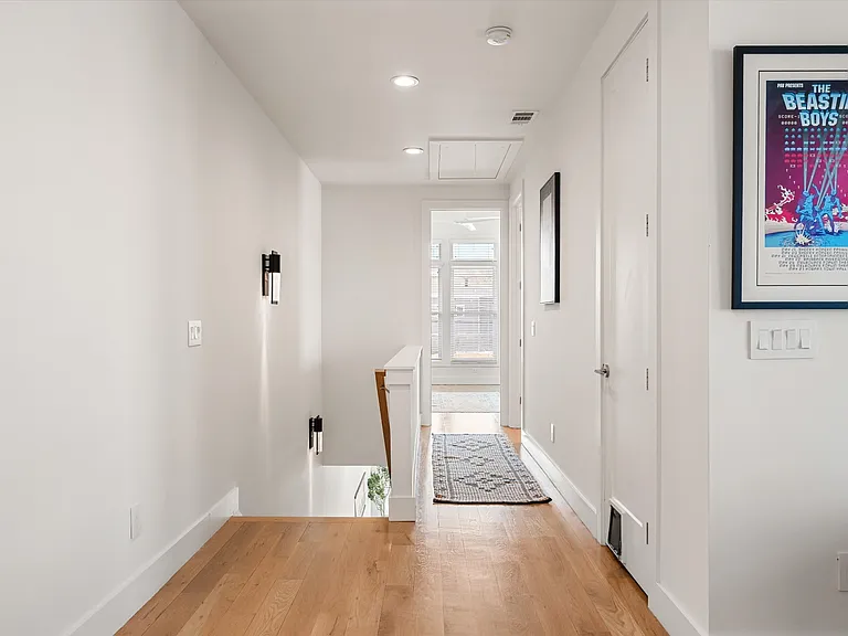 Second-floor landing connecting flex space, primary suite, and bedrooms 2 & 3.