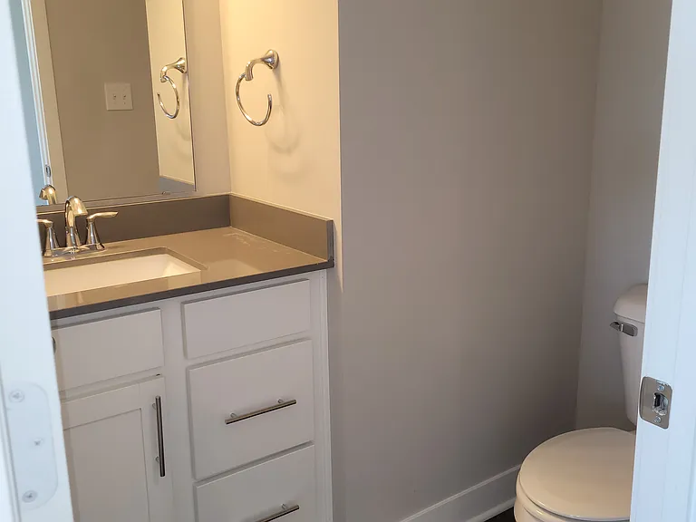 The all purpose room has its own half bath