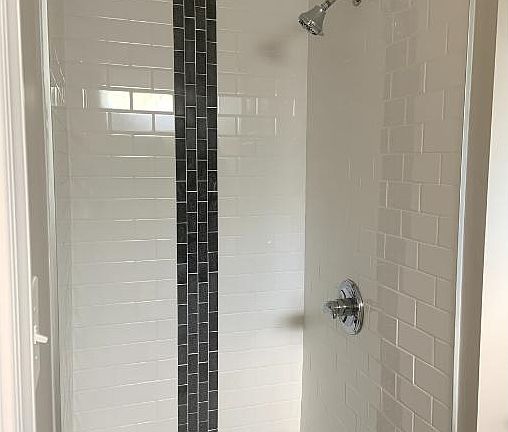 Refresh and rejuvenate in our modern bathroom with clean, contemporary fixtures and a spacious layout.