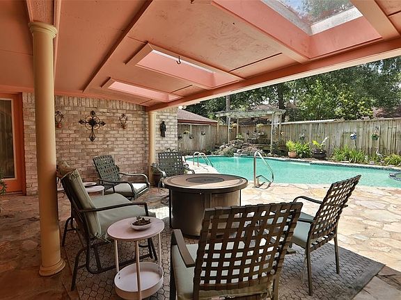 This extended covered patio has three skylights providing shade and protection. Enjoy lunch, barbecuing, entertaining, or taking a break from the hot sun or temporary showers.