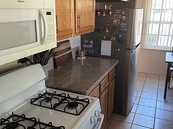 Kitchen with Granite Countertops and tile floor