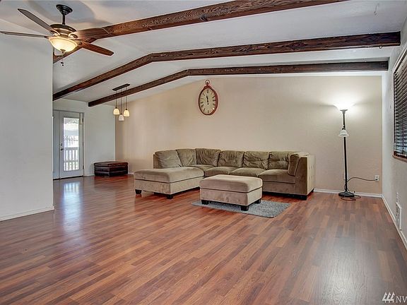 Large living with beamed ceiling.