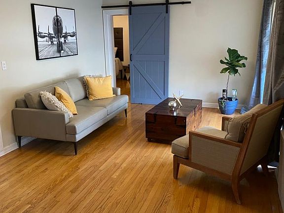 living room with a door view to the master bedroom