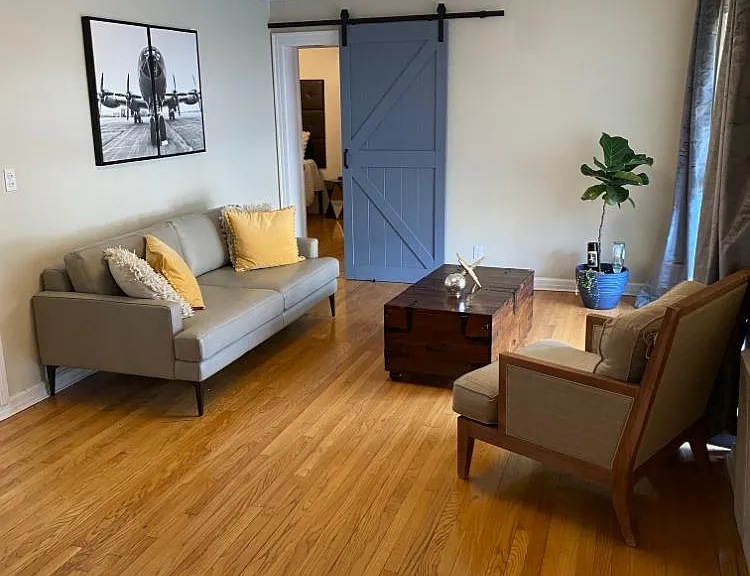 living room with a door view to the master bedroom