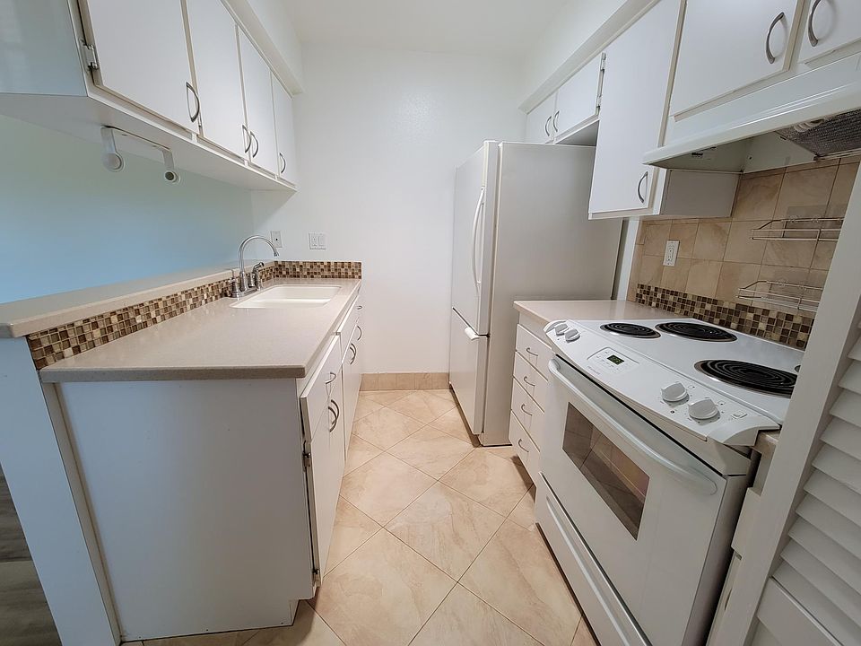 Kitchen; includes fridge, electric stove